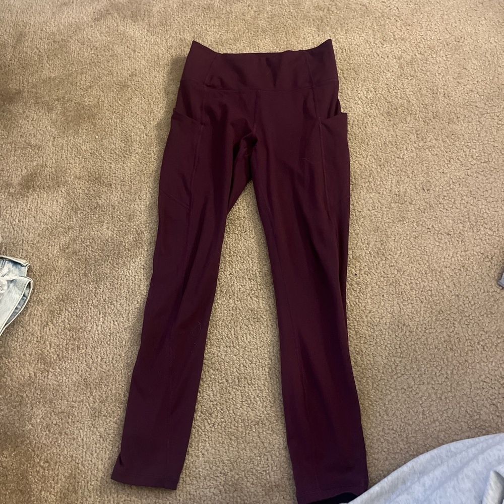Maroon/burgundy Fabletics leggings with pockets